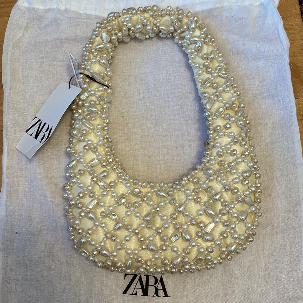 Brand new with tags and dust bag. Pearl shoulder bag from Zara